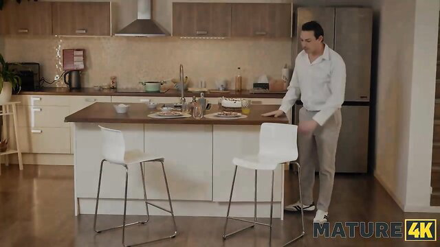 Lynna Nilsson hot mature in kitchen, white shirt grey pants