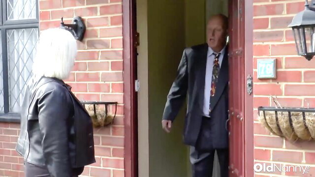 British Blonde MILF Maggie Moon in leather jacket at door with Sam Bourne