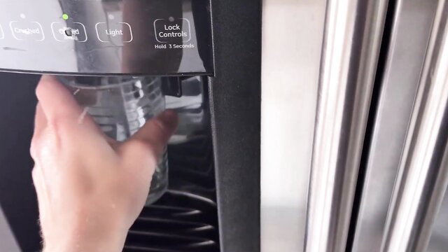 Skinny girl's stepbro caring for her at fridge water dispenser