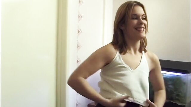 Newbie Lisa smiling in white tank top in first XXX photoshoot