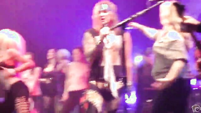 Stunning babes flash big tits at wild concert party