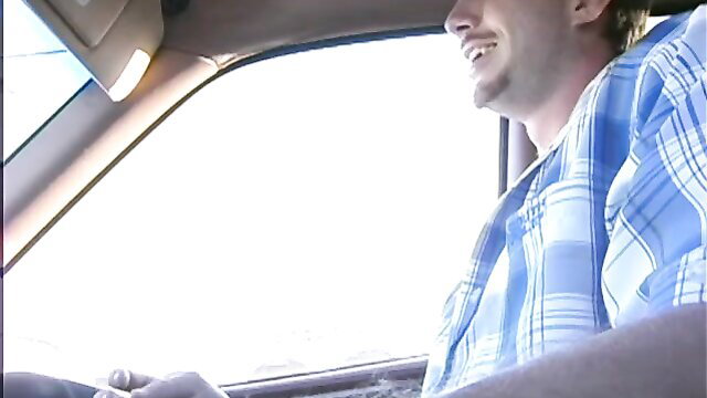 Jordan Ash smiling in car POV driving, blue plaid shirt unbuttoned