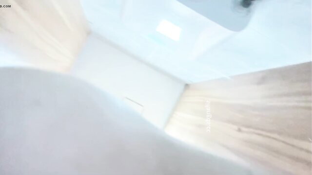 Close-up voyeur of woman pissing in toilet, upskirt view