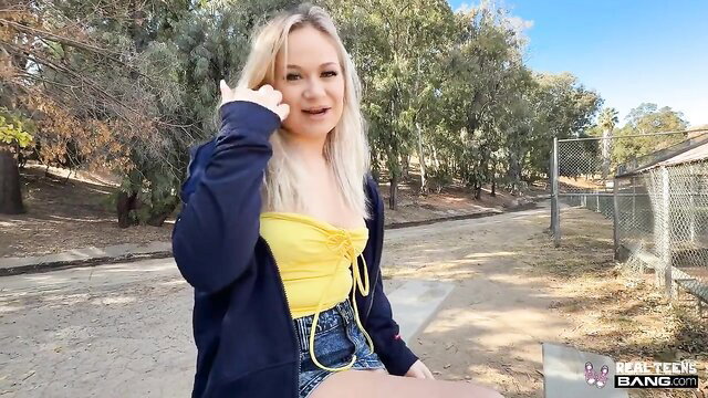 Rylee Blake in yellow top and denim shorts at outdoor park