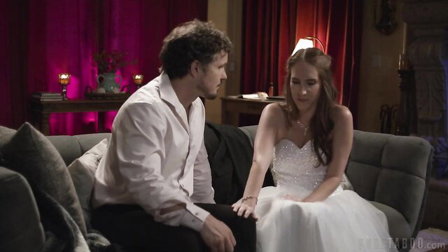 Cadence Lux in wedding dress with man on couch in PureTaboo scene