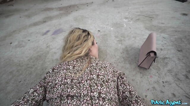 Blonde Pamela Mendoza lying on ground in patterned blouse, Public Agent