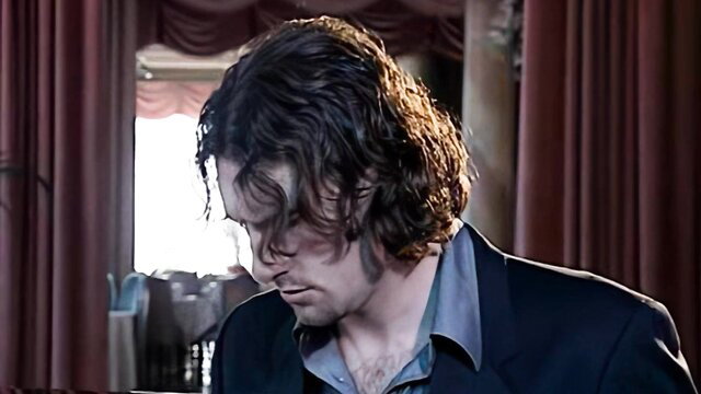 Jane Darling in Figa Del Boss: curly haired man in suit thoughtful closeup