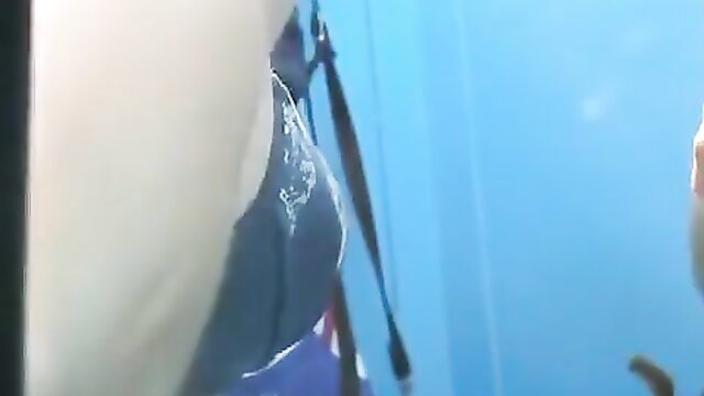 Spy cam catches busty Asian changing in beach locker room