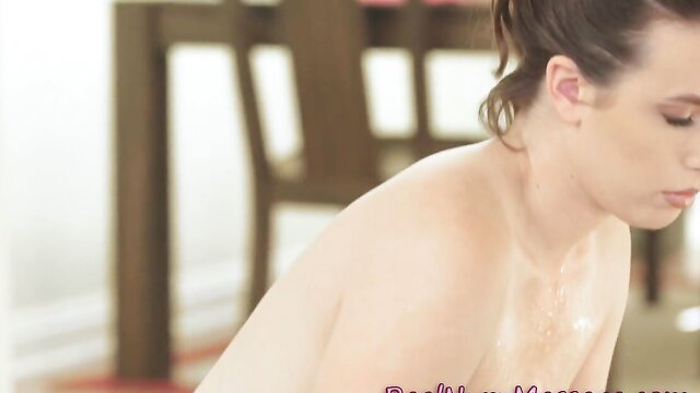 Brunette masseuse with small tits nude on table, oiled skin