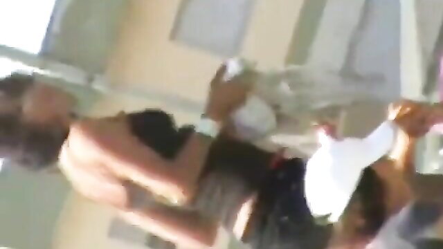 Topless black beach hottie in skimpy black dress squeezing big tits