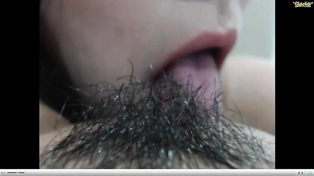 Colombian cam girl sticks out tongue with beard-like hair close-up