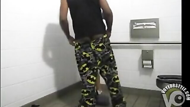 Man posing in a college restroom