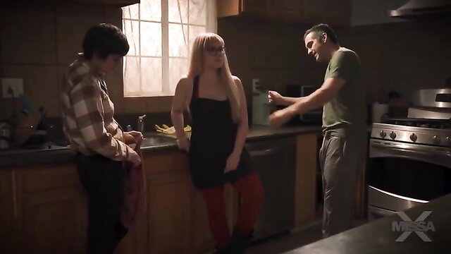 Jessica Ryan in hot black dress and red stockings with studs on movie night