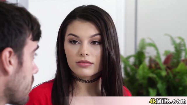 Long-legged brunette wife in red dress and choker teases eager lover close-up