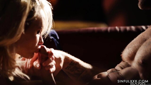 Blonde cook seduced by tattooed man, closeup blowjob in dim light