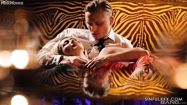 Veronica Leal and Jay Snake in steamy embrace on zebra couch