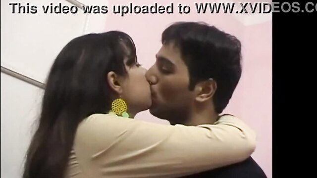 Egyptian couple passionately kissing, woman in beige top with big earrings