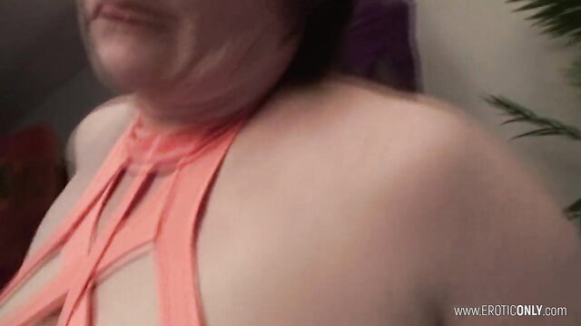 Bulky mature farmer in orange lingerie shows off curves closeup