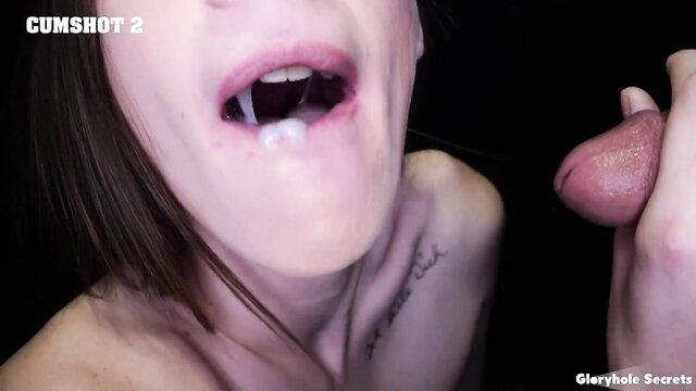 Brunette gets facial cumshot in mouth holding cock at gloryhole