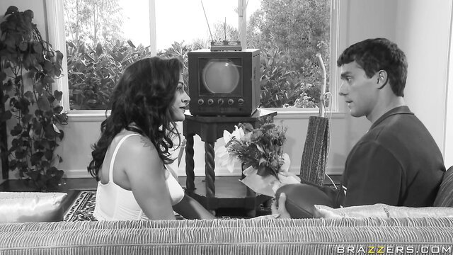 Raylene in seductive black & white closeup with flowers, Brazzers