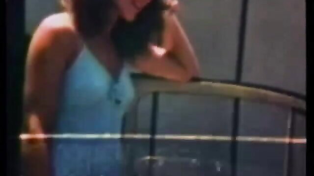 Dawn from Pretty Girls 108 leans seductively in sheer white lingerie