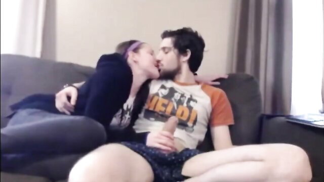 Horny stepsis in purple hair kisses guy on couch while stroking his dick