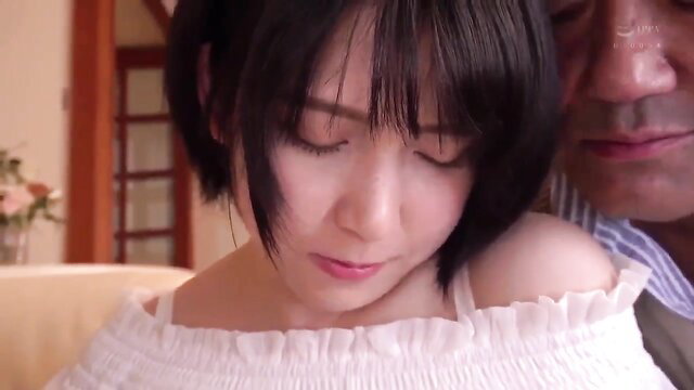 Asian short-haired wife nuzzles older man's face intimately close-up