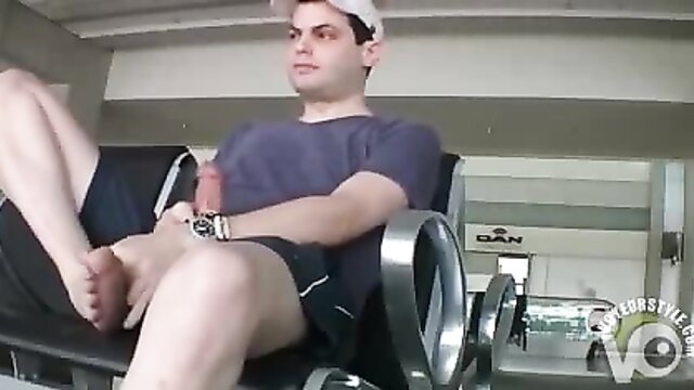 Dude in baseball cap jerks off with dildo in airport lounge