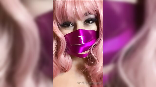 Pink wig masked ASMR birthday girl in purple satin mask closeup