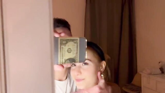 Busty young Italian babe smiling selfie with cash, big tits tease