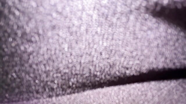 Blurry closeup of woman's gray sweatpants-clad ass in fart fetish tease