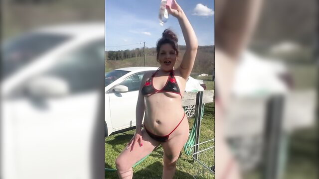 Big butt MILF in skimpy bikini washing car outdoors, thick curvy body