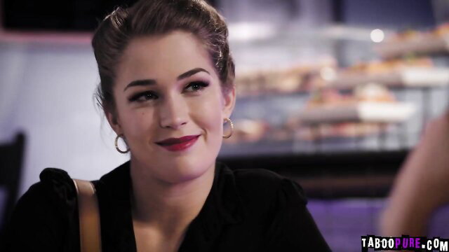 Evelyn Claire smiling seductively in black top, Candice Dare adult video thumbnail