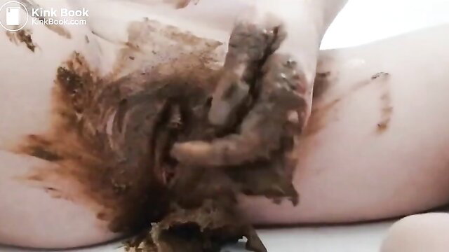 Closeup of woman's pussy filled with scat and smeared on thighs