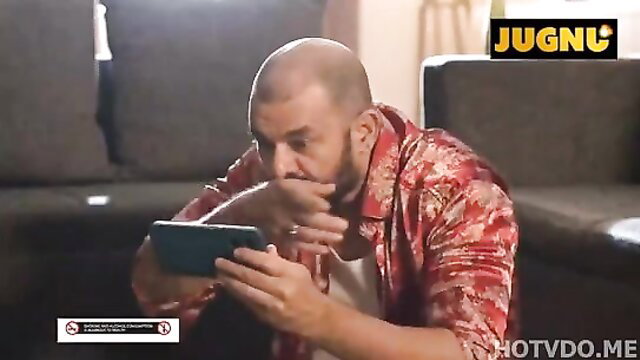 Bald Indian man in silk shirt shocked watching phone in Room No 69 web series