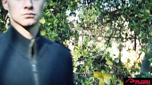 Handsome twink closeup in dark jacket, Falcon Studios gay initiation tease