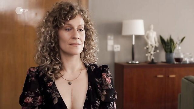 Alessija Lause sexy cleavage in floral dress, nude tits celeb scene