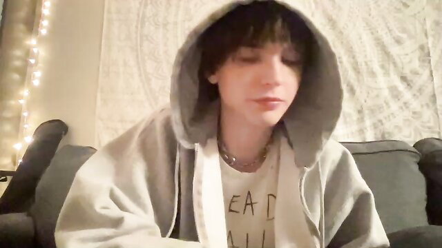 Cute twink in hoodie with necklace on couch, gay amateur thumbnail