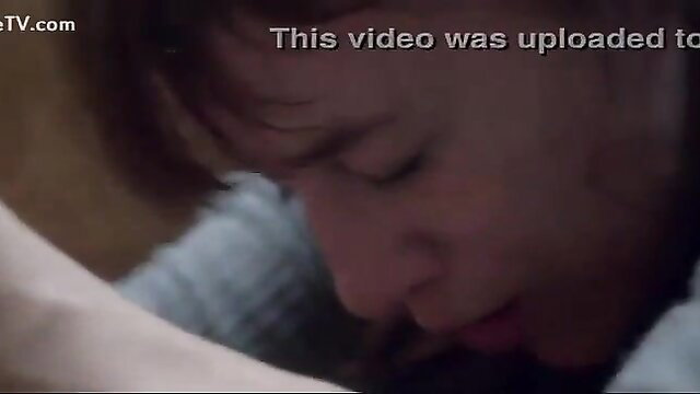 Closeup of man passionately kissing woman's hand in intimate scene