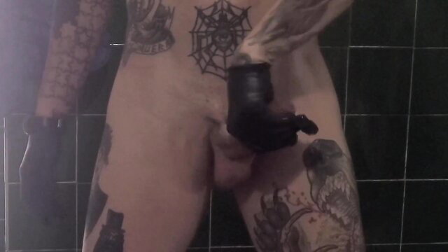 RyderKnoxoficial tattooed hunk jerks with black leather glove in solo bathroom vid