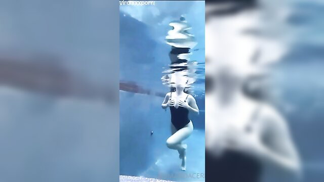 Amanda Cerny underwater in tight black swimsuit teasing tits