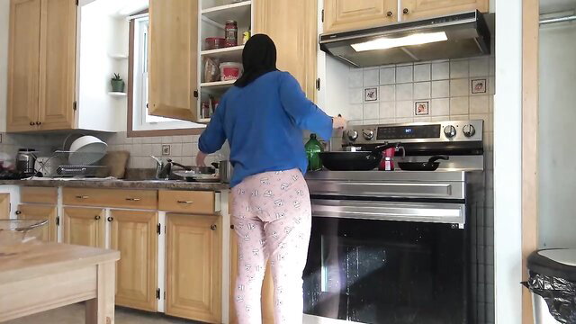 Souzan Halabi cooking in tight pink pants and blue sweater, sexy Arab amateur