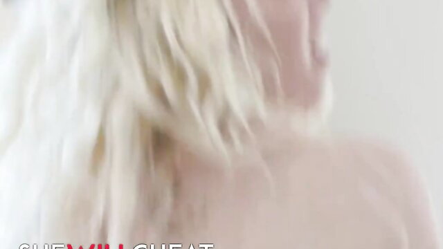 Blonde woman with long hair, possibly naked, partial face