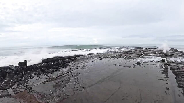 SparksGoWild topless at stormy beach rocks, wild ocean waves