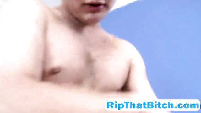 Young muscular guy shirtless closeup, ripped abs blue background