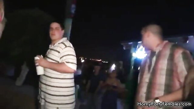 Drunk amateur party girls surrounded by horny guys at wild night bash