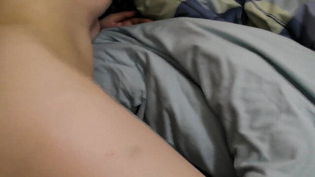 Asian woman nude in bed, teasing neckline and sheets, amateur tease