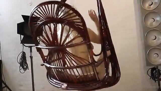 Bad Dolly in white dress on swing, teasing pose adult video