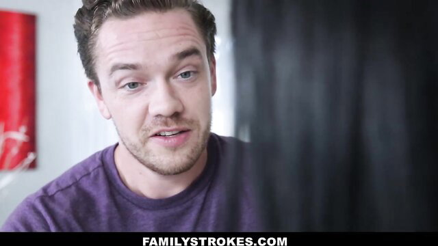 Hot guy in purple tee smirks at camera in taboo FamilyStrokes scene