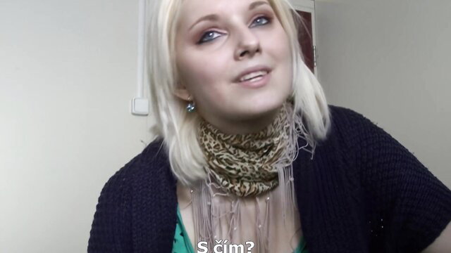 Freshly legal blonde teen in scarf and cardigan smiling closeup